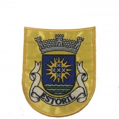 Emblema bordado amarelo com escudo azul e texto ESTORIL