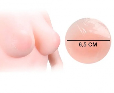 Seios artificiais rosa claro com medida de 6,5 CM reproduzida em círculo ampliado