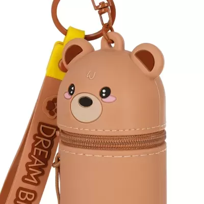 Porta-chaves ou porta-moedas em forma de urso castanho claro com fecho éclair e pendente amarelo e castanho com texto DREAM BEAR