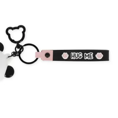 Porta-chaves preto e rosa com texto HUG ME e detalhes de patas