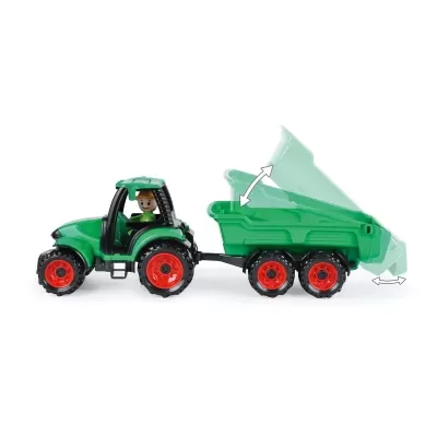 Tractor verde e vermelho de brinquedo com atrelado basculante e figura humana numa cabina.