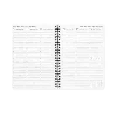 Agenda semanal aberta com páginas brancas e encadernação em espiral preta