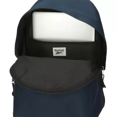 Mochila Reebok azul escura com interior preto aberta, mostrando transporte para portátil