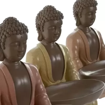 Três estátuas decorativas de Buda em diferentes cores segurando tigelas