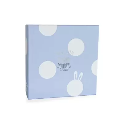 Caixa azul clara com círculos brancos e texto DOUDOU & COMPAGNIE