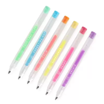 Seis canetas coloridas com tampas e corpo transparente com texto e símbolos florais.