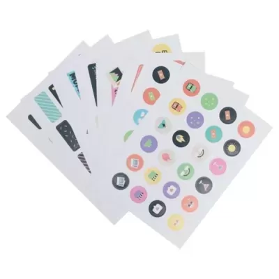 Folhas com autocolantes coloridos redondos com ícones variados