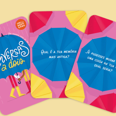 Cartas coloridas com textos em português e padrões de guarda-chuvas