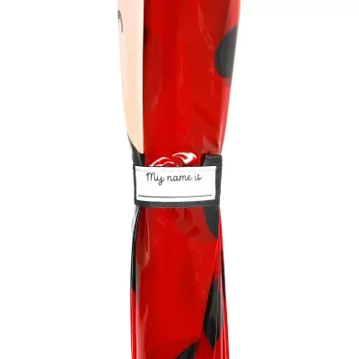 Guarda-chuva vermelho com bolinhas pretas e faixa para nome
