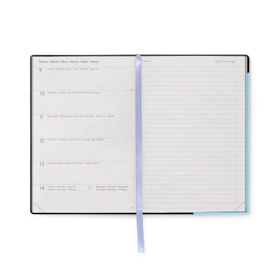 Agenda semanal aberta com datas e espaço para anotações