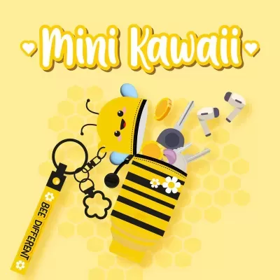 Porta-chaves abelha amarelo e preto com chaveiro e texto BEE DIFFERENT