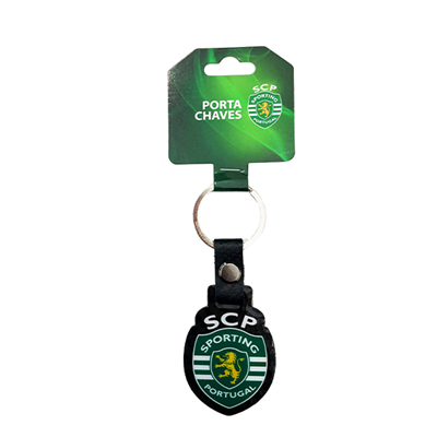 Porta-chaves do Sporting Portugal com logo em verde, branco e amarelo, anel metálico e embalagem verde.