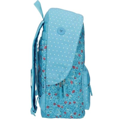 Mochila azul com padrão floral e bolinhas brancas vista de lado