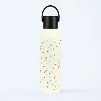 Garrafa reutilizável branca com padrão floral e tampa preta