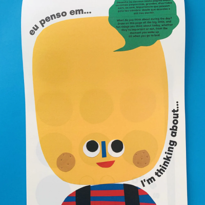 Página de livro infantil com ilustração colorida de personagem e texto em português e inglês.