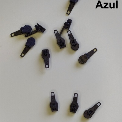 puxadores de fecho éclair azuis escuros sobre fundo branco com a palavra 'Azul'