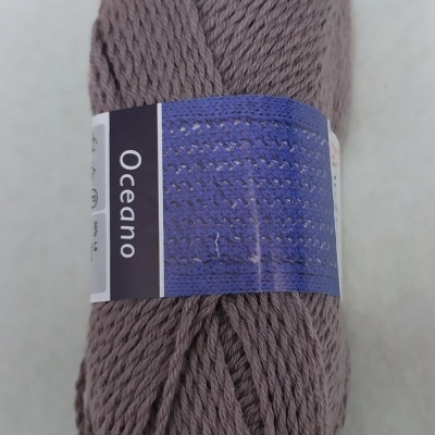 Skein of muted brownish-lilac yarn labeled Oceano Cor 25