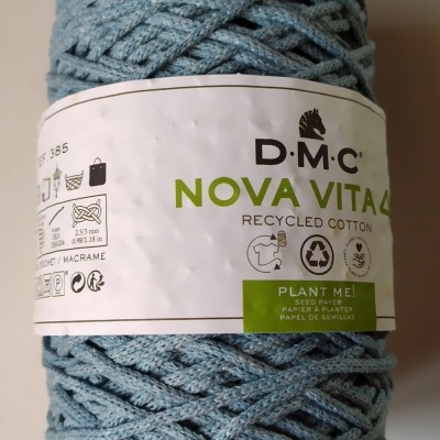 Skein of blue recycled cotton yarn with DMC Nova Vita4 label and 'Cor 7' text