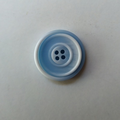 Botão redondo azul claro e branco com padrão ondulado