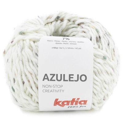 Novelo de lã branca com pontos coloridos e rótulo Katia Azulejo