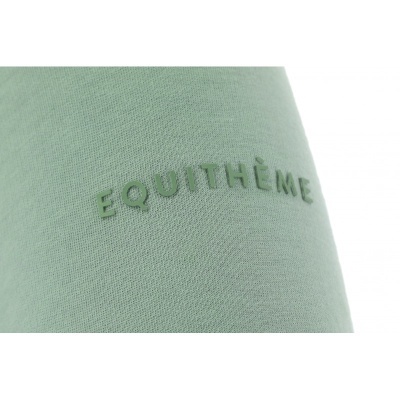 tecido verde claro com texto EQUIHTÈME em relevo