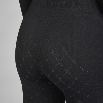 Calças justas pretas com padrão em xadrez e palavra 'jadron.' na cintura