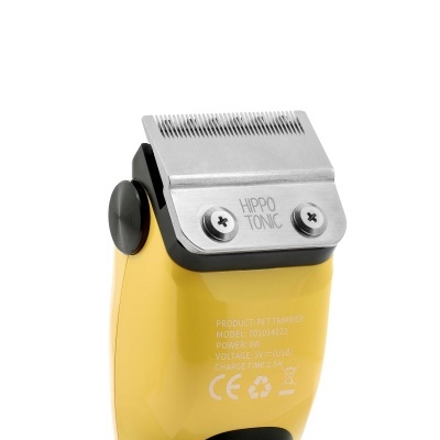 Máquina de cortar cabelo eléctrica amarela com lâmina metálica prateada e texto HIPPO TONIC