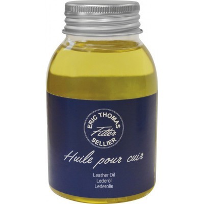 Frasco de óleo para couro com etiqueta azul escura e tampa prateada