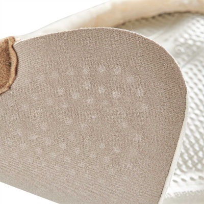 Sola de sapatilha de balé bege com textura e pontos antiderrapantes