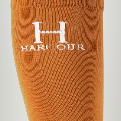 Meia alta laranja com logotipo branco HARCOUR bordado.