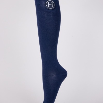 Meia comprida azul escuro com emblema circular com a letra H