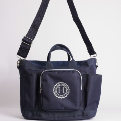 Mala azul escuro com bolso frontal e alça ajustável