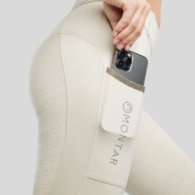 Leggings creme com bolso lateral e smartphone preto