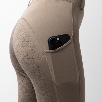 Calças taupe com padrão floral e bolso lateral com telemóvel