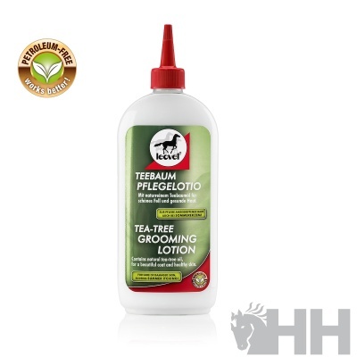 Frasco branco com tampa vermelha de loção para cuidados com pelo e pele tea tree