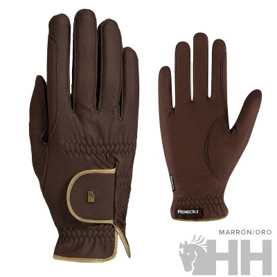 Luvas marrons com detalhes amarelos e etiqueta Roeckl em fundo branco.