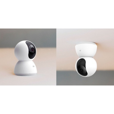 Câmeras de segurança inteligentes branca com lentes pretas, uma sobre superfície e outra no teto