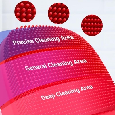 Escova de silicone vermelha com zonas de limpeza e texturas distintas