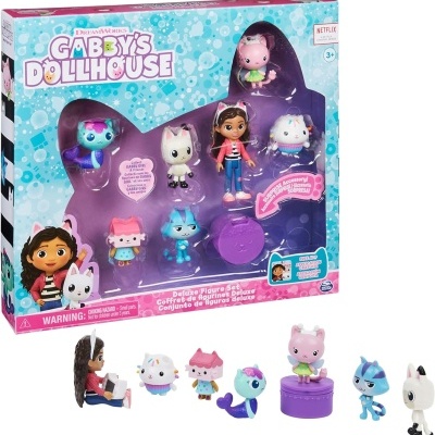 Conjunto de brinquedos de figuras pequenas e coloridas com boneca e animais, em embalagem 'GABBY'S DOLLHOUSE'