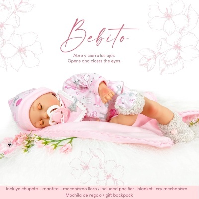 Boneca bebé com roupa rosa, chupeta e cobertor cor-de-rosa sobre fundo branco