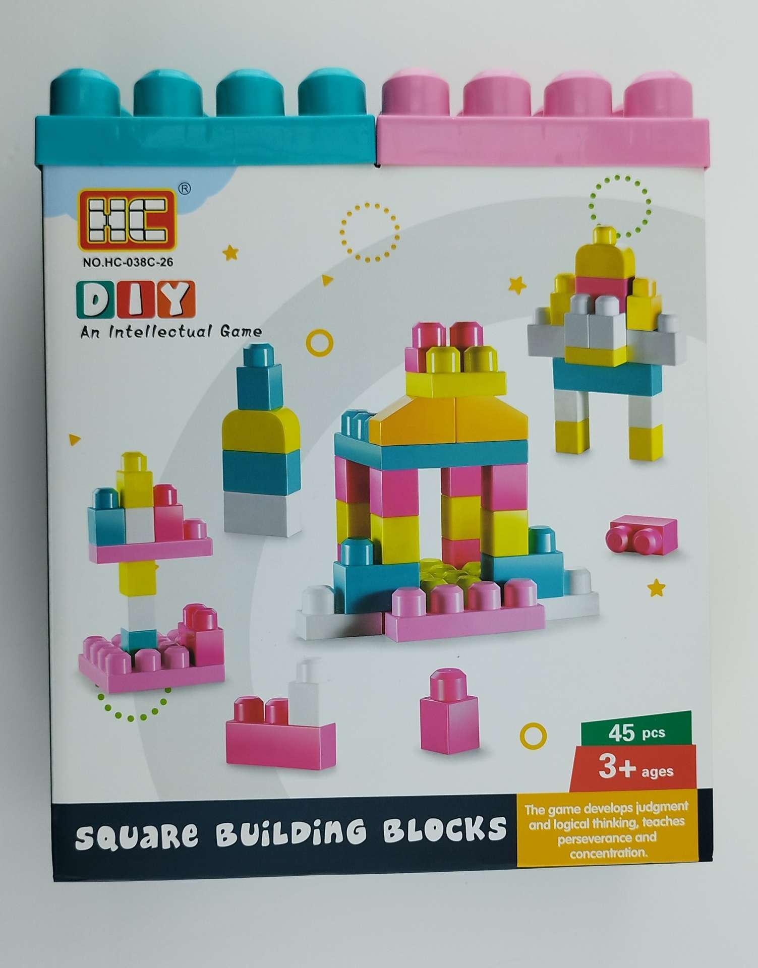 MEGA BLOCOS DE CONSTRUÇÃO COLORIDOS - 45 PEÇAS Caixa branca com imagens coloridas de blocos de construção em azul, amarelo, rosa, branco e verde