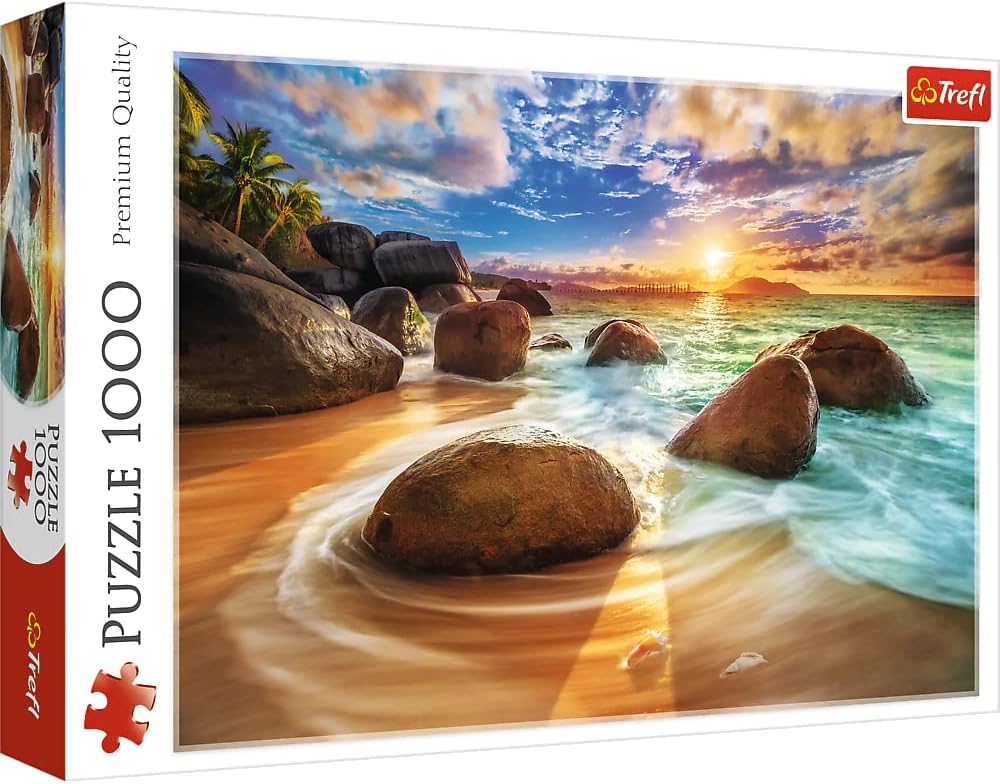 PUZZLE PREMIUM QUALITY: PRAIA SAMUDRA (ÍNDIA) - 1000 PEÇAS, TREFL Caixa de puzzle Trefl com imagem de praia e rochas ao pôr do sol