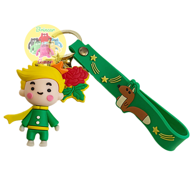 Porta-chaves com personagem, flor e pulseira verde com desenhos