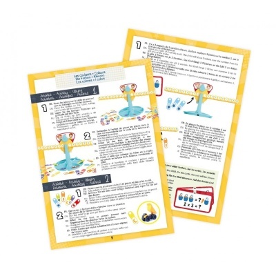 Instruções coloridas para jogo com balança e fichas em folhas amarelas e brancas