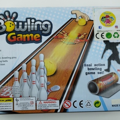 Caixa do jogo Bowling Game com ilustração de pinos e bolas e texto explicativo
