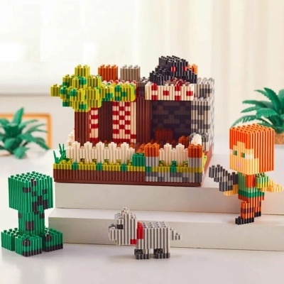 Brinquedos de blocos de construção pixel art com personagens e uma casa colorida