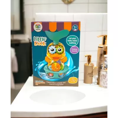 Embalagem de brinquedo de banho infantil Little Duck com pato amarelo e peças de engrenagens coloridas.