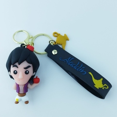 Porta-chaves do Aladdin com figura, fita com texto e imagem de lâmpada, fundo branco