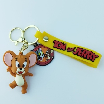 Porta-chaves com figura de Jerry do Tom and Jerry, fita amarela com texto e selo redondo