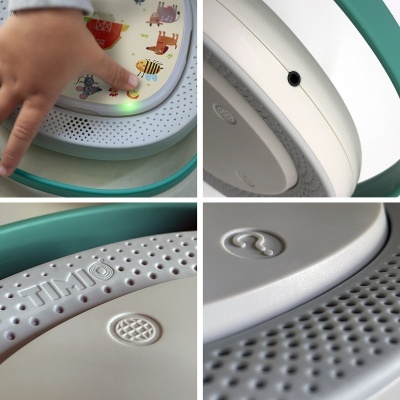 Detalhes de brinquedo infantil em plástico com botões de animais e textos TIMO e símbolo ?